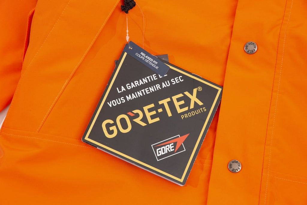 The North Face Men's GORE-TEX Hooded Mountain Jacket | Orange & Black Color Block