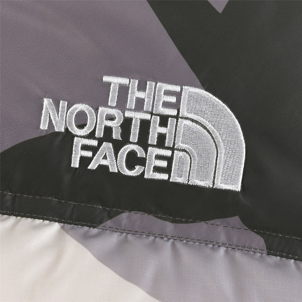 The North Face x KAWS 1996 Retro Nuptse Jacket Multi Camo | Women's & Men's Streetwear