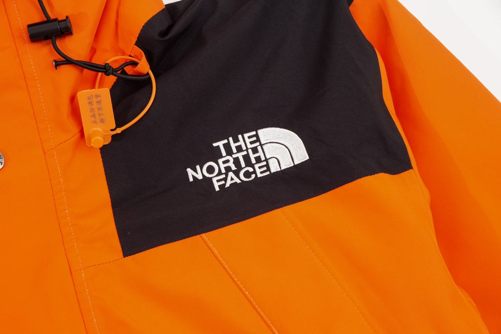 The North Face Men's GORE-TEX Hooded Mountain Jacket | Orange & Black Color Block